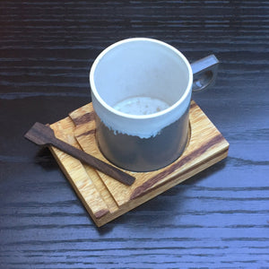 This unique ceramic handmade mug comes with an exotic marblewood coaster and built-in ebony wood stir spoon. Coasters are designed so they also be easily stacked for efficient storage or simply use it as a lid until your ready to enjoy your coffee or favo